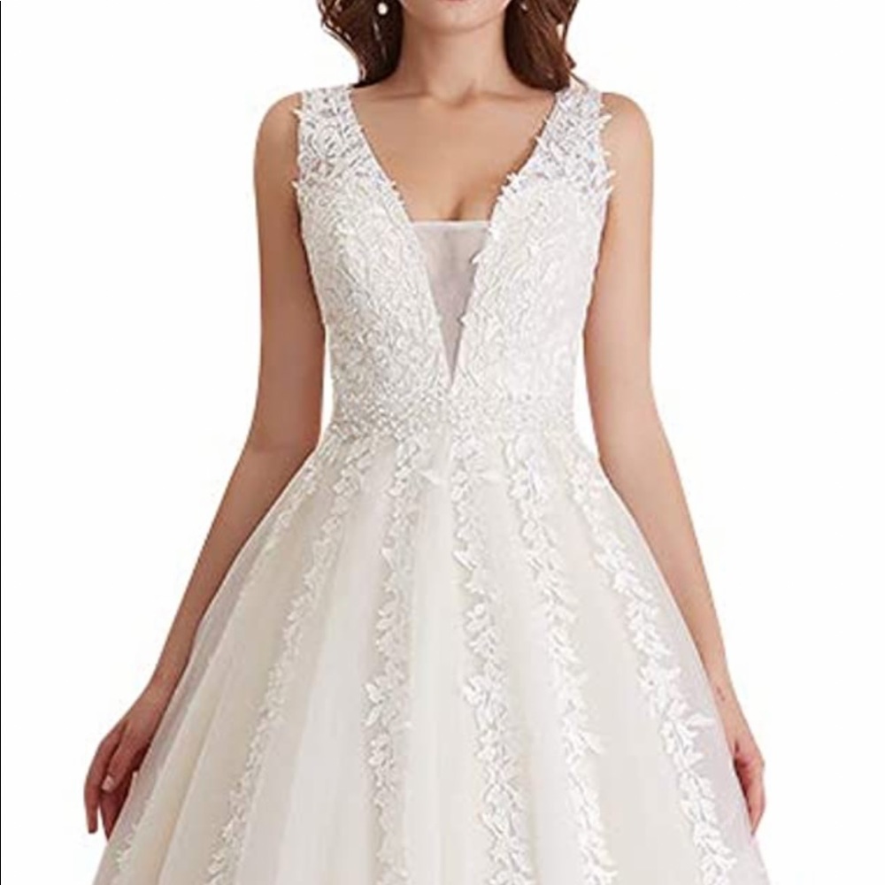 Size 24 fits like a 20 Wedding dress brand new with tags